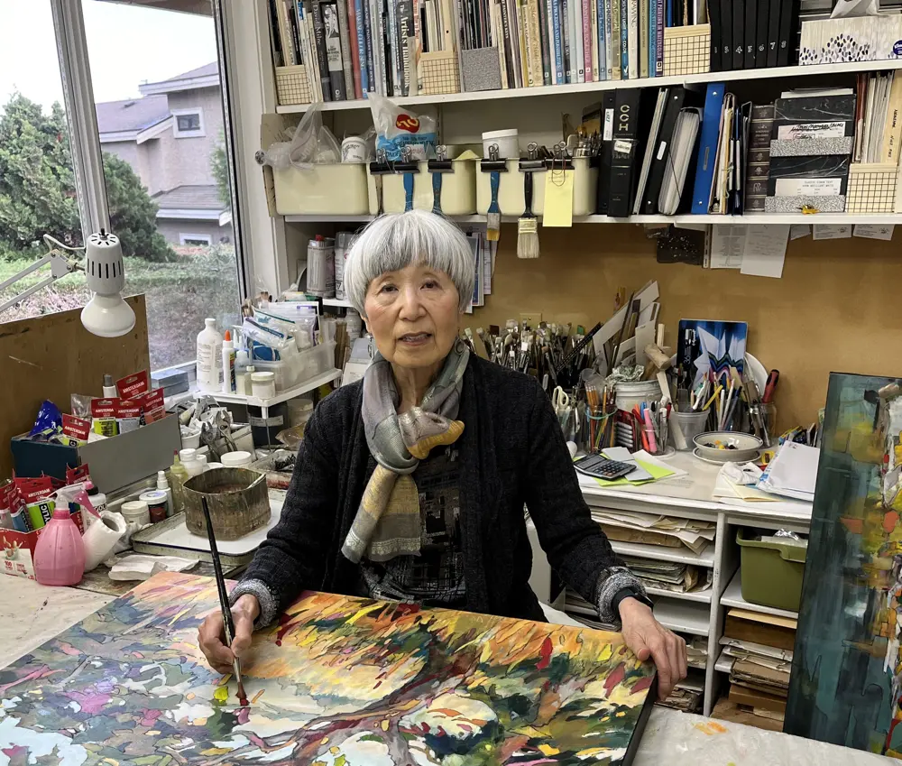 artist painting in her studio
