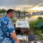 Artist painting at the waterfront in Steveston